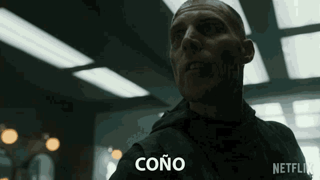 a man with the word cono written on his chest