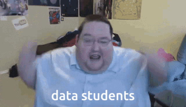 a fat man with glasses and a shirt that says data students on it