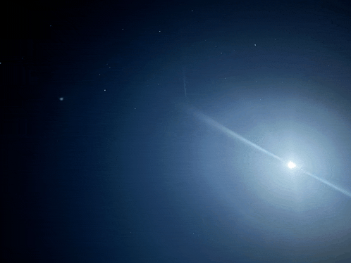 the sun is shining brightly in the dark blue sky