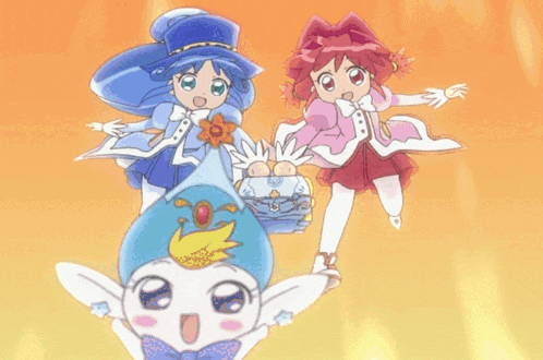 two little girls are standing next to each other and one is wearing a top hat