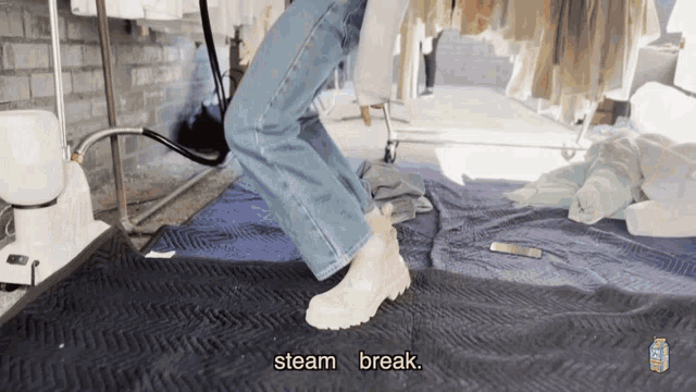 a person standing on a blue blanket with the words steam break written on the bottom