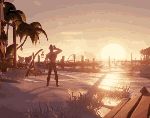 a man stands on a beach at sunset