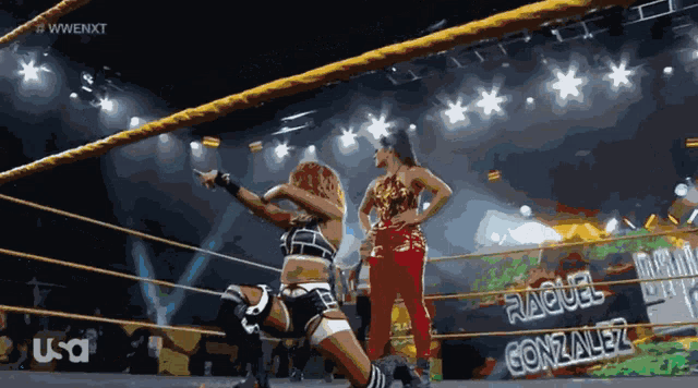 two women in a wrestling ring with the name raquel gonzalez on it