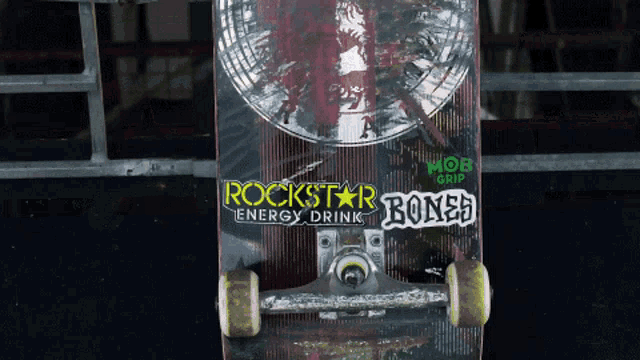 a skateboard with a rockstar energy drink sticker