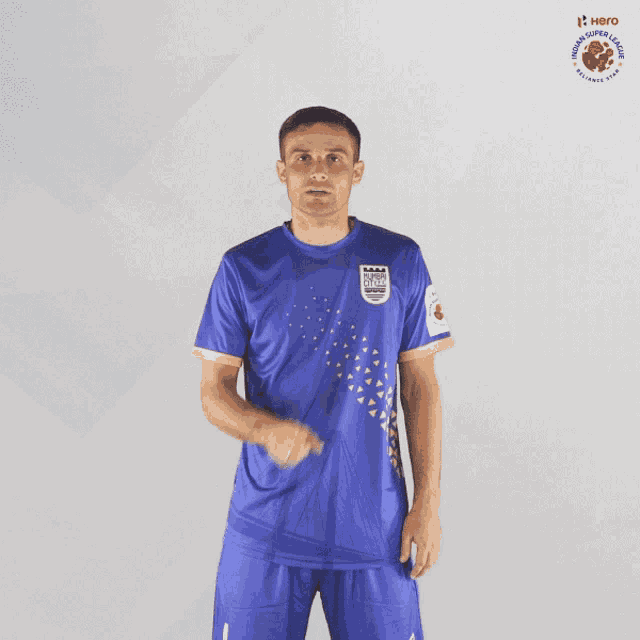 a man wearing a blue jersey that says ' chennai super kings ' on it