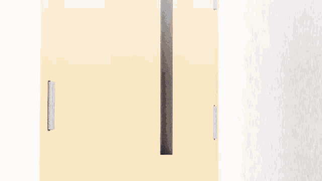 a girl with cat ears is standing in a doorway looking out .