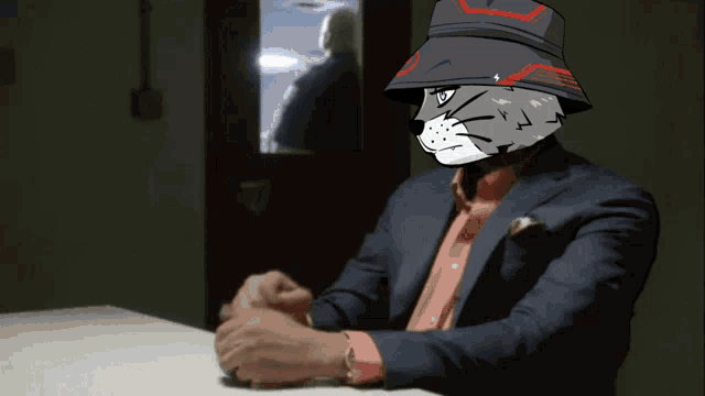 a man in a suit and hat with a cat face