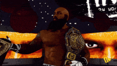 a bald man with a beard is wearing a wrestling belt