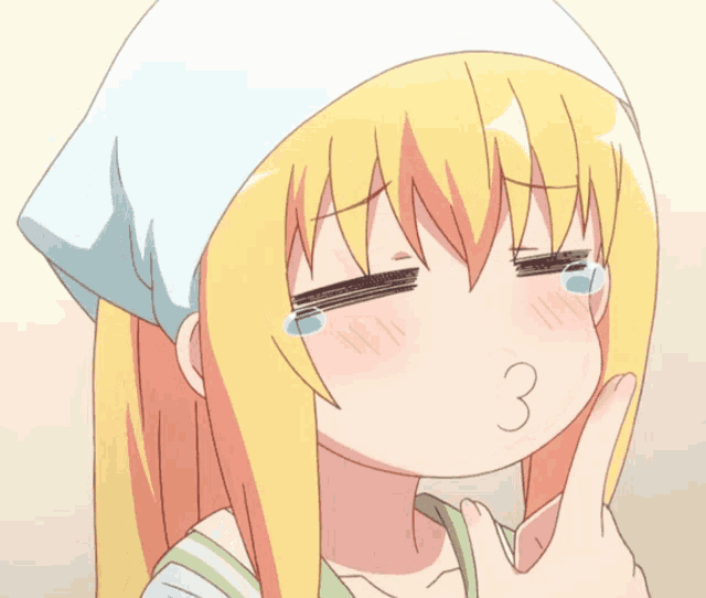 a girl with blonde hair and a white hat is making a funny face