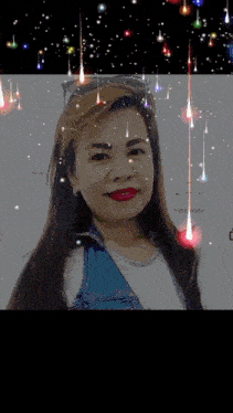 a woman with glasses and red lipstick is surrounded by glowing lights