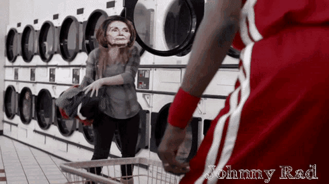 a man in a red and white jersey is standing in a laundromat next to a woman with a mask on her face