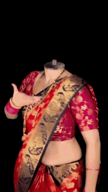 a woman without a head is wearing a red and gold blouse