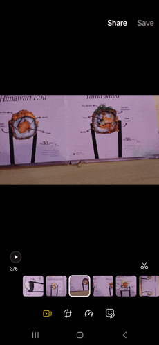 a phone screen shows a screenshot of a sushi menu