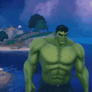 hulk is standing in front of a body of water with trees in the background