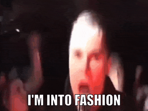 a blurry image of a man with the words " i 'm into fashion " on the bottom