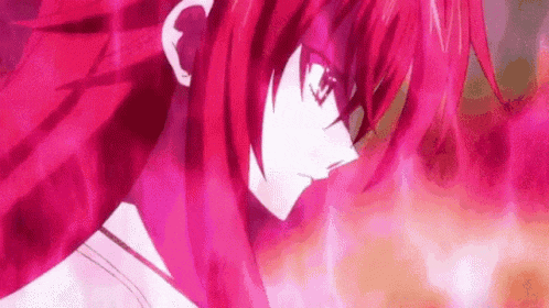 a close up of a person with red hair and glasses in a pink background .