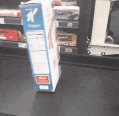 a box of kellogg 's original cereal sits on a grocery store checkout line
