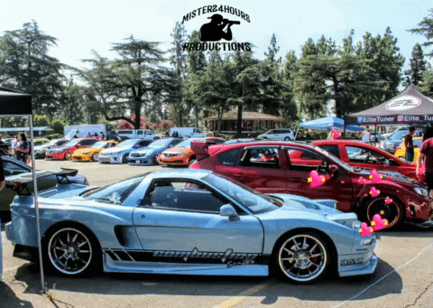 a group of cars are parked in a parking lot sponsored by mister24hour productions