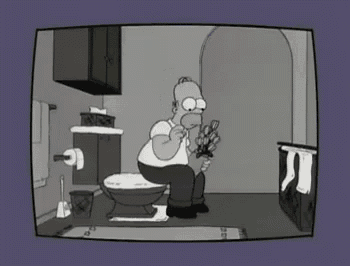 a cartoon of homer simpson sitting on a toilet holding a pair of scissors .