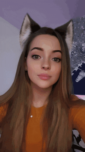 a woman with long hair and cat ears on her head