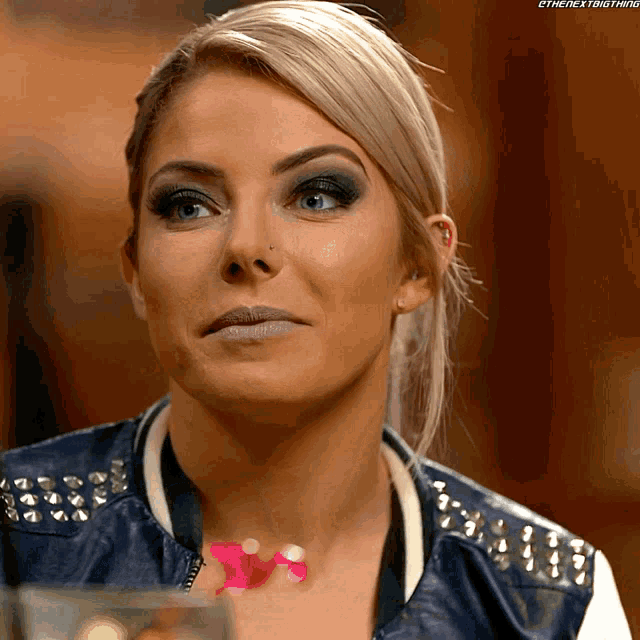 a close up of a woman 's face with the next thing written on the bottom right