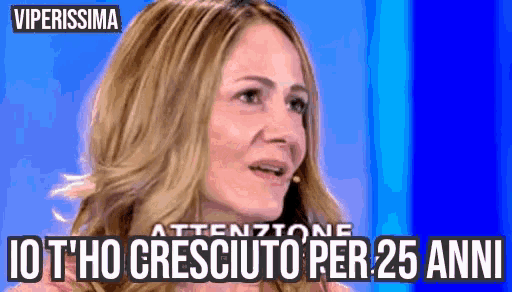 a woman in a pink shirt is crying with the words " io t'ho cresciuto per 25 anni " on the bottom