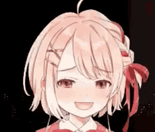 a close up of a girl 's face with a red bow on her head .