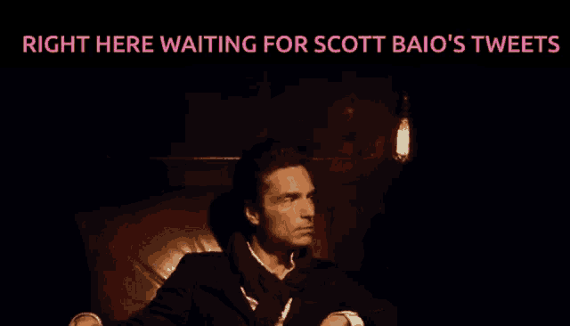 a man sitting in a chair with the words right here waiting for scott baio 's tweets