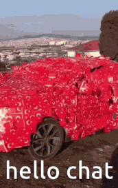 a red car wrapped in red tissue paper with the words hello chat written on it