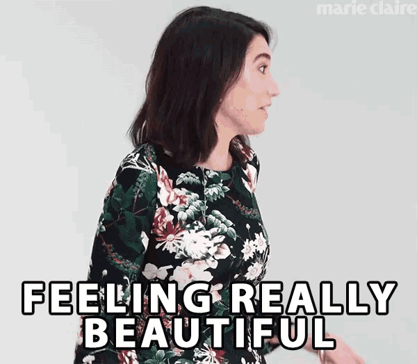 a woman in a floral dress is saying feeling really beautiful