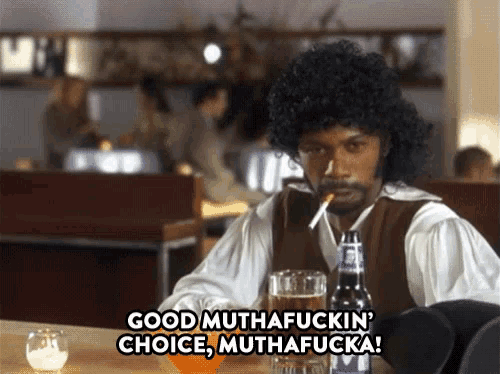 a man sitting at a table with a beer and a cigarette says good muthafuckin choice
