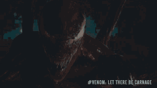 a close up of venom with the words #venom let there be carnage on the bottom
