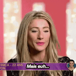 a woman with blonde hair and a sign that says mais euh