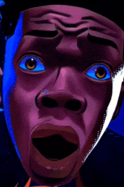 a close up of a person 's face with a surprised look on their face
