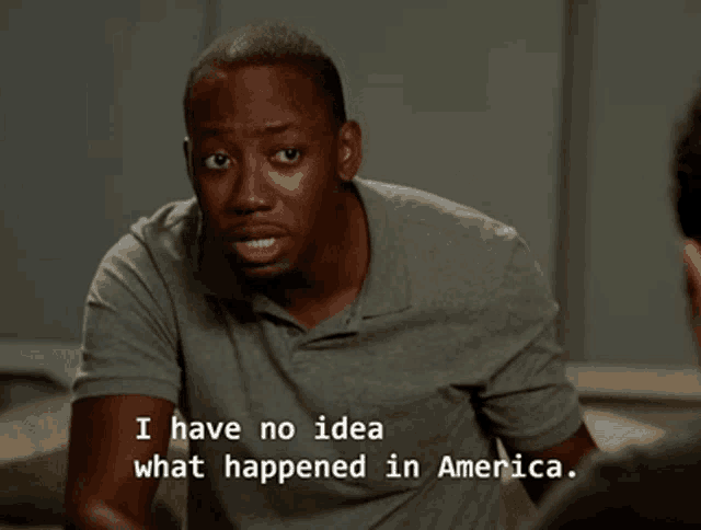 a man in a grey shirt is talking to another man and says " i have no idea what happened in america "