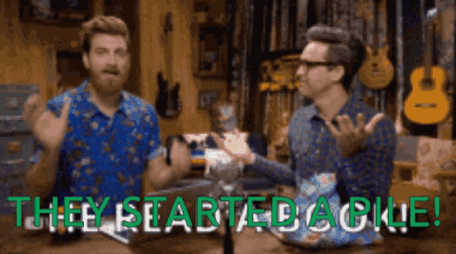 two men are sitting at a table with the words " hey started dakle " written in green letters