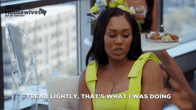 a woman says tread lightly that 's what i was doing in front of a real housewives poster