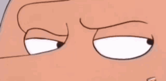 a close up of a cartoon character 's eyes with a slight smirk on his face .