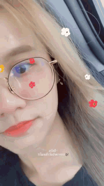a close up of a woman 's face with glasses and flowers on her face