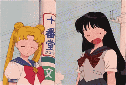 two anime girls are standing next to a pole with chinese writing