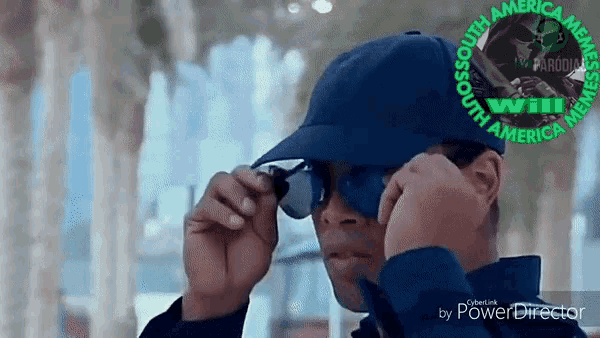 a man wearing sunglasses and a hat with a logo that says south america on it