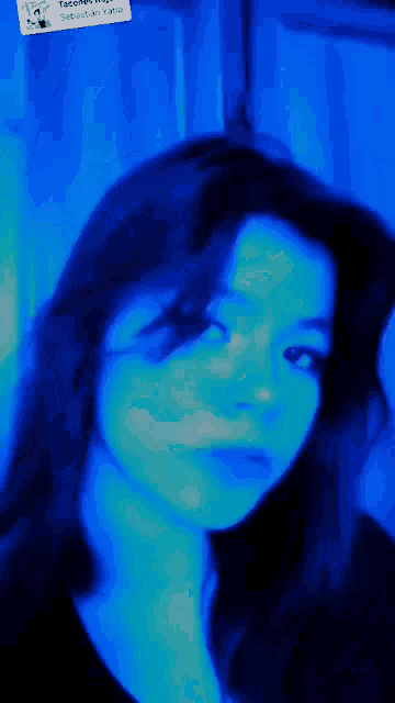 a woman 's face is shown with a blue background and a tag that says tacobell