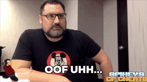 a man with glasses and a mickey mouse shirt says " oof uhh "