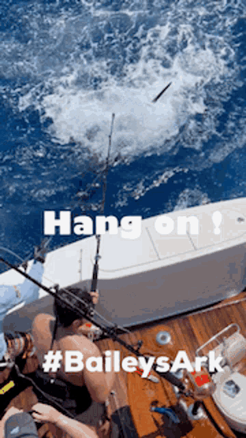 a picture of a man fishing with the caption hang on