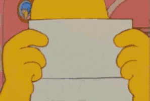 a cartoon of homer simpson is standing in front of a red couch