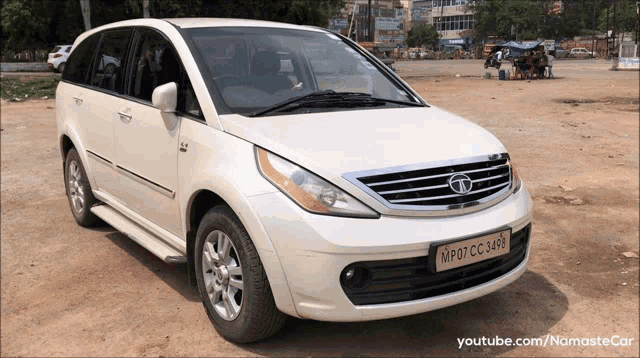 a white tata car with a license plate that says mp07 cc 348b