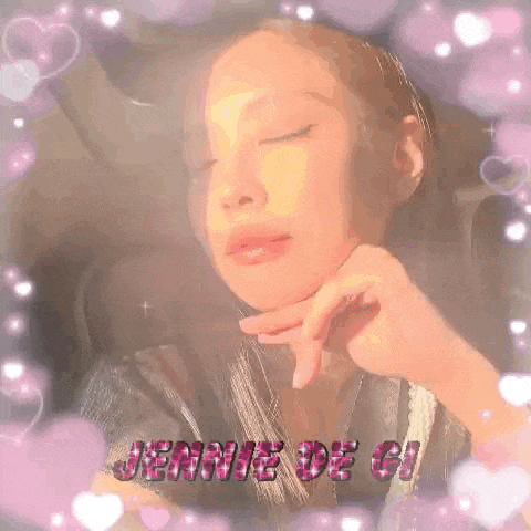 a close up of a woman 's face with her eyes closed surrounded by pink hearts and sparkles .