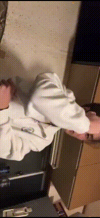 a person is laying on a bed with a blanket on their head