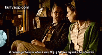 a man and a woman are sitting next to each other and the man says if i could go back