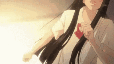 a girl with long black hair is wearing a white shirt and red bow tie .